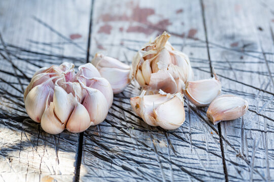 Bulbs of garlic on a wooden surface