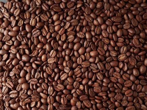 top view of fresh roasted coffee beans background © Mikhail