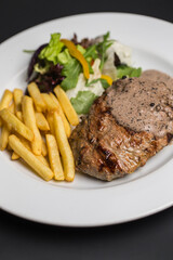 Meat steak and sauce in restaurant