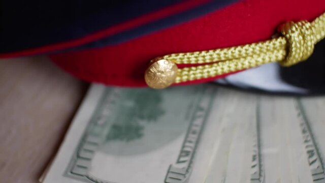 policeman Russian FBI got money dollars bribe corruption covered with his uniform cap