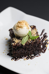 Chocolate piece of cake and vanilla ice-cream