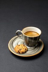Espresso coffee and cookie for coffee break