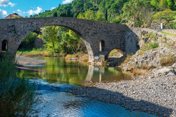 Fototapeta na wymiar The bridge of the River l'Orbieu in the vvillage of Lagrasse in the South of France