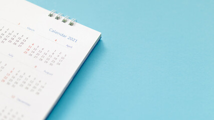 Obraz premium 2021 calendar page on blue background business planning appointment meeting concept