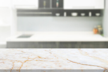 white marble stone counter top with blurred kitchen background
