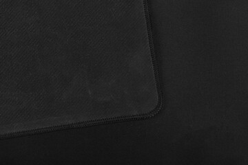 Texture of black fabric gaming mouse pad closeup