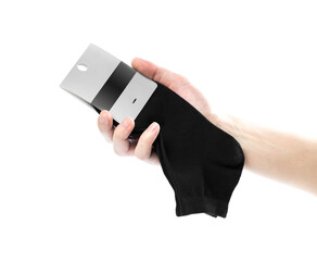 Hand holding a new pair of black short socks in the package. Close up. Isolated on a white background