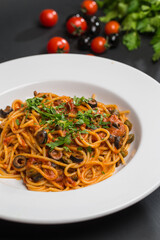 Cooked pasta with vegetables and tomatoes