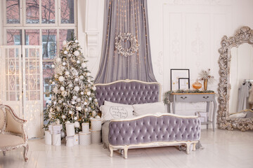 The vintage interior of the New Year's bedroom is decorated in white and gray tones