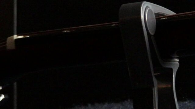 Capo placed on acoustic guitar