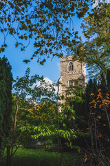 Fototapeta na wymiar Tower of All Saints Church near Bishops Park, Fulham, London, UK