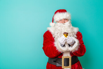 Santa blowing candle on birthday cupcake