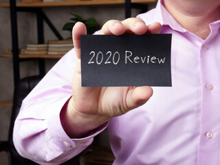 2020 Review e phrase on the piece of paper.