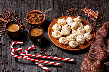 Meringue cookies on a dark wooden background