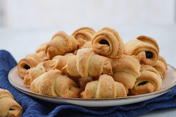 Homemade bagel cookies with marmalade inside. Sweet croissant cookies. Selective focus