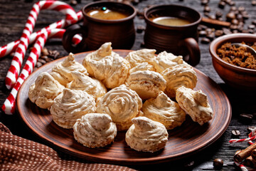 Meringue cookies on a dark wooden background