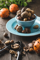 nuts and nutcracker. Christmas photo with Christmas nuts mix and oranges