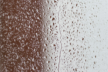 raindrops on glass seen from inside on a rainy day