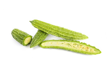 Closeup shot of sliced green bitter gourds isolated on a white background