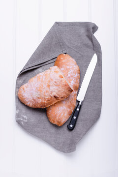 Ciabatta on a cloth napkin with a knife