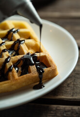 Homemade Belgium wafers with topping and sugar filling