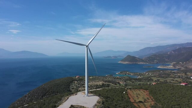 Windmills in Greece on a mountain overlooking the sea. Greece. Drone video