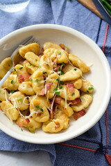 Gnocchi with bacon and asparagus beans. Italian food.