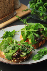 Sandwiches with salmon, avocado and salad	