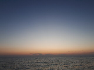 Obraz premium Calm sea, sunset, clouds, sky