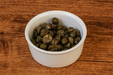 Tasty capers in the bowl
