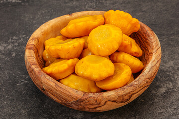 Marinated yellow patisson in the bowl