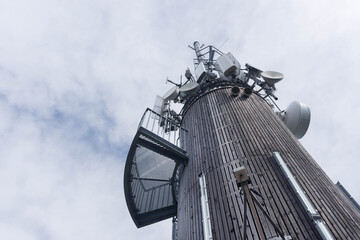 Lake Worthersee, Austria- August 26, 2020: The Pyramidenkogel, the highest wooden viewing tower in the world, on the lake shore, famous tourists attraction in Carinthia region