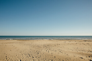 Fototapeta na wymiar Empty beach in France, Provence, sunny day, sea without waves