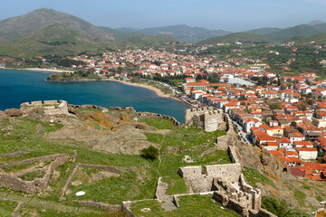 Fototapeta na wymiar The town of Myrina, in Lemnos island, Greece, and part of the castle of the town. The local medieval castle is one the largest in the Mediterranean.