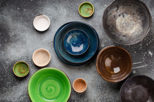 Assorted ceramic hand-made multicolored empty plates and bowls