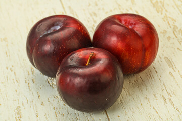 Ripe sweet plum fruit heap