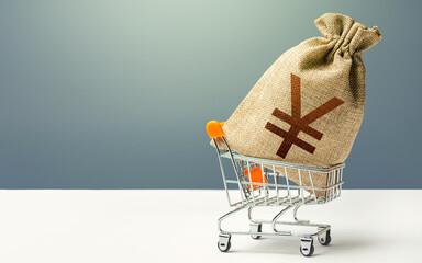 Yuan Yen money bag in a shopping cart. Profits and super profits. Minimum living wage. Business and...