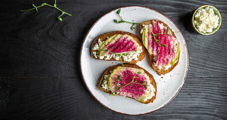 vegetarian Bruschetta with goat cheese, watermelon radish. banner, catering menu recipe place for text, top view