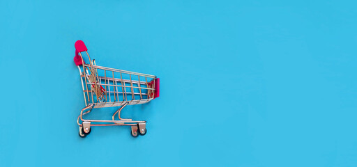 Shopping cart on a blue background Black Friday. Sale.