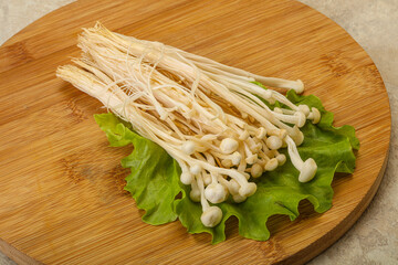 Raw Enoki mushrooms for cooking