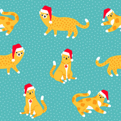 Christmas leopard and tiger cats in Santa's hats on pastel blue polka dot background seamless pattern.