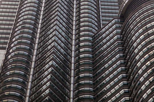 Closeup pattern of modern skyscraper buildings architecture, sky in Kuala Lumpur  aerial view through. Kuala Lumpur, Malaysia- January 2018, windows closeup