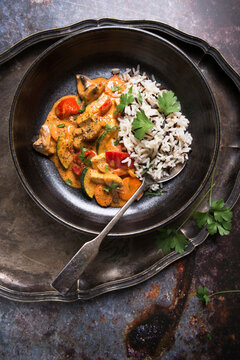 Coconut and tomato curry with vegetables and tofu, with rice and wild rice mixture