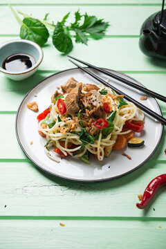 Asian Noodles With Vegetables, Mizuna And Misome Salad And Mock Duck (vegan Duck Made From Wheat Protein)