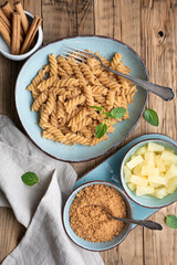 Fusilli pasta with sweet roasted semolina and cinnamon, served with pineapple pieces