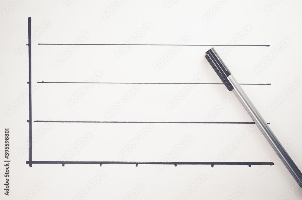Aufkleber top view closeup of a graph on a white paper with a pen on it
