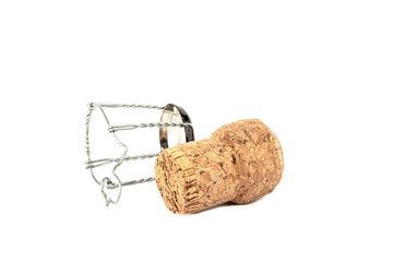 Champagne cork and muselet separately on a white background.
