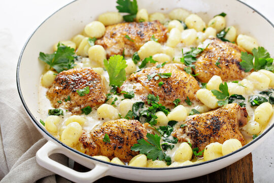 Roasted chicken thighs with gnocci and spinach