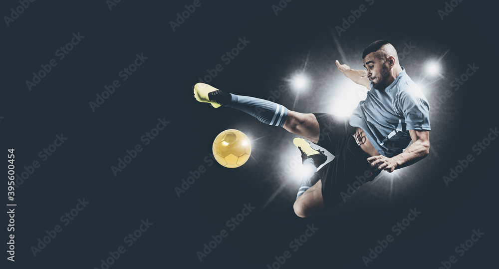 Wall mural Soccer player in action on dark background