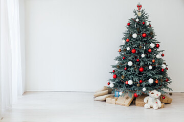 Beautiful decorated room with Christmas tree with presents under it